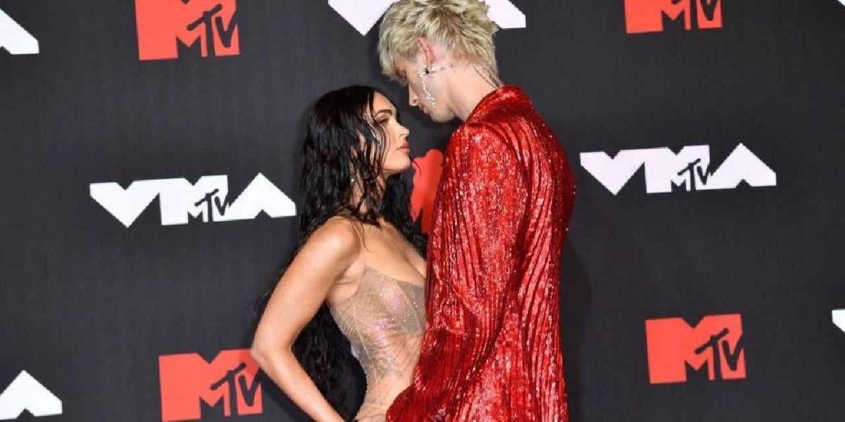 Megan Fox is seen during a Machine Gun Kelly concert straddling him